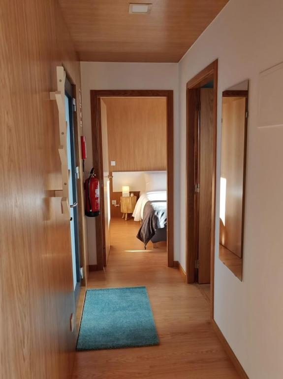 Postel nebo postele na pokoji v ubytování Horizonte Monte Verde