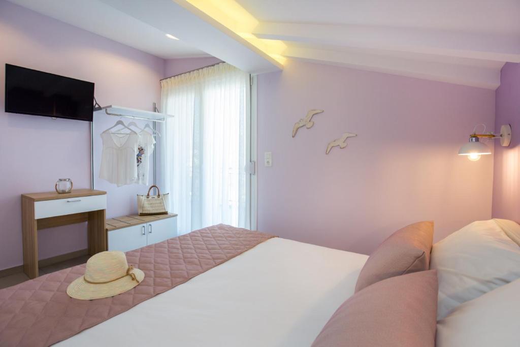 Postel nebo postele na pokoji v ubytování GiRene Apartments