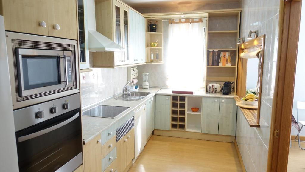 Kuchyň nebo kuchyňský kout v ubytování Villa Flores