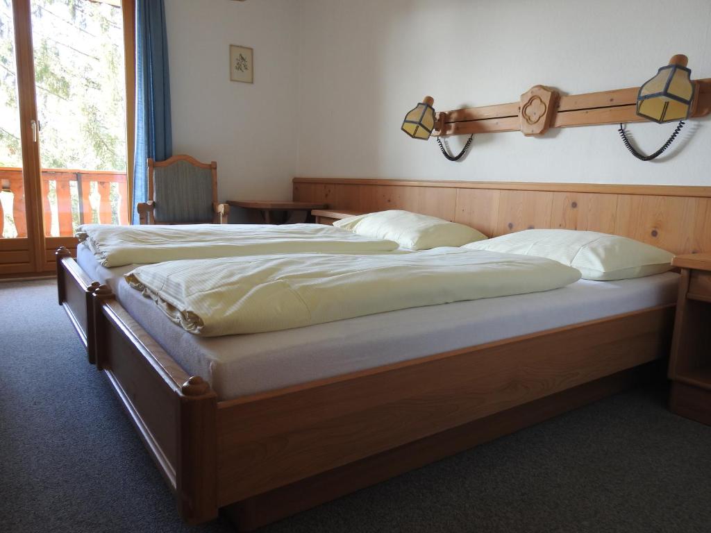 A bed or beds in a room at Hotel Carossa bed&breakfast