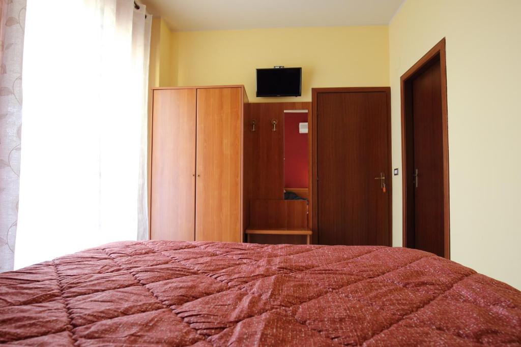 Łóżko lub łóżka w pokoju w obiekcie Valle D'Agrò