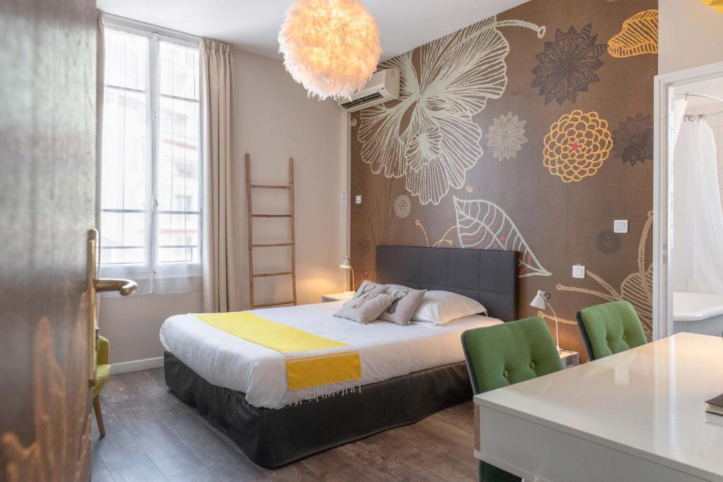 Postel nebo postele na pokoji v ubytování Hôtel Cecil - Adults only