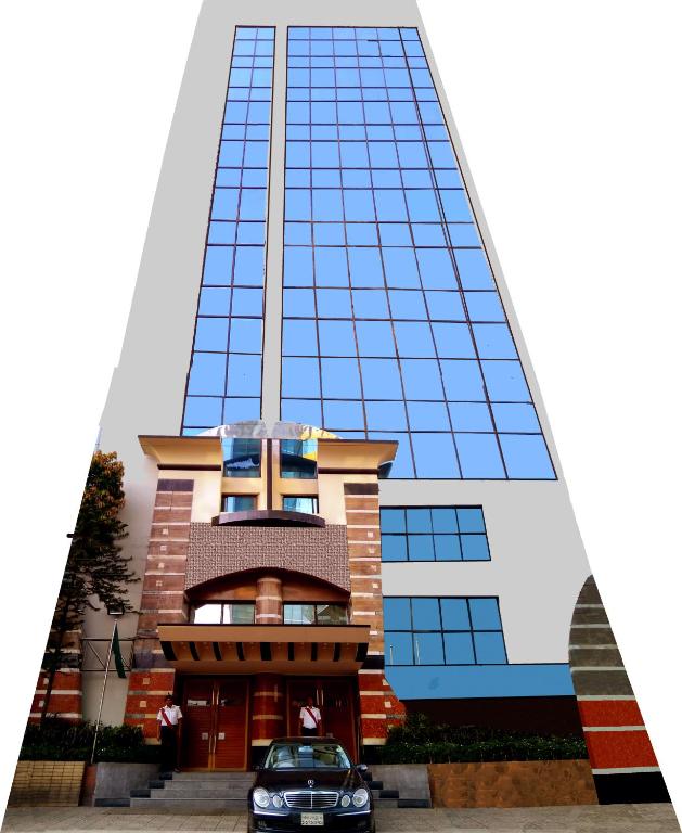 a building with a car parked in front of it at La Vinci Hotel in Dhaka