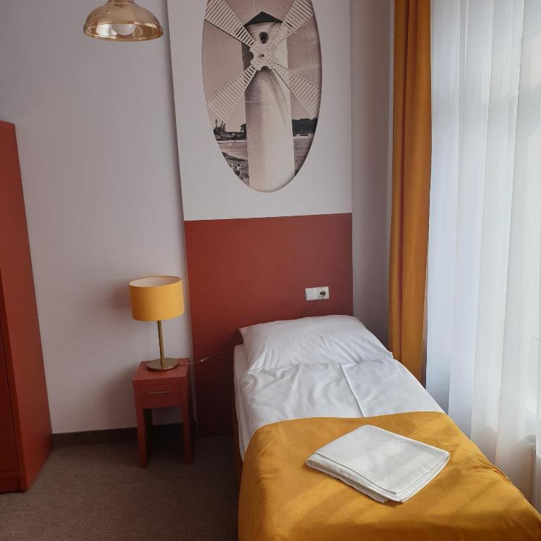 Postel nebo postele na pokoji v ubytování Dom Zdrojowy Amber