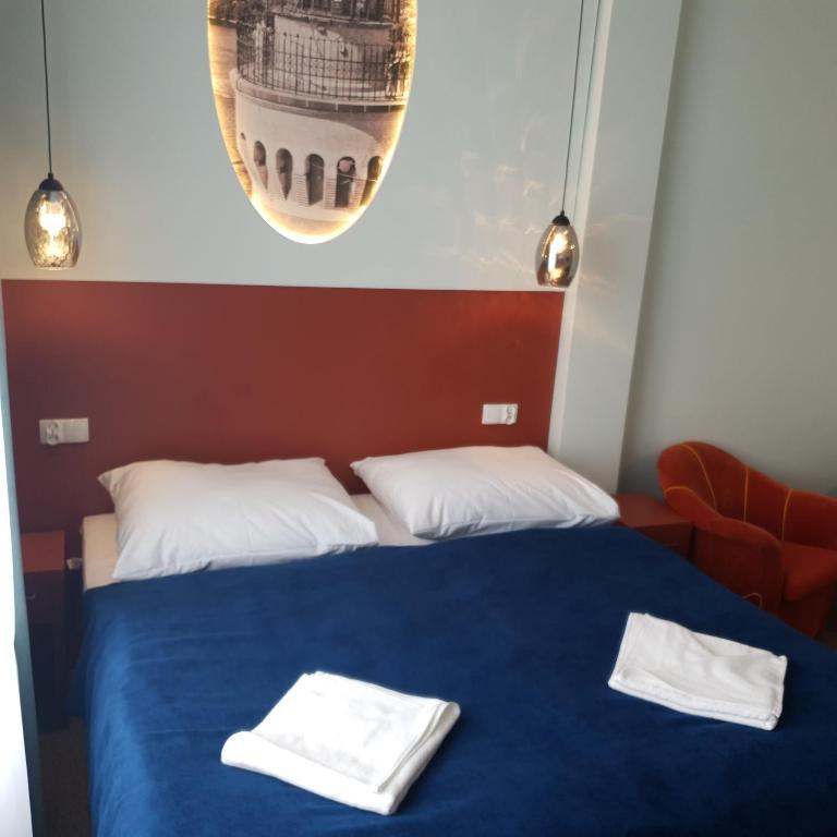 Postel nebo postele na pokoji v ubytování Dom Zdrojowy Amber