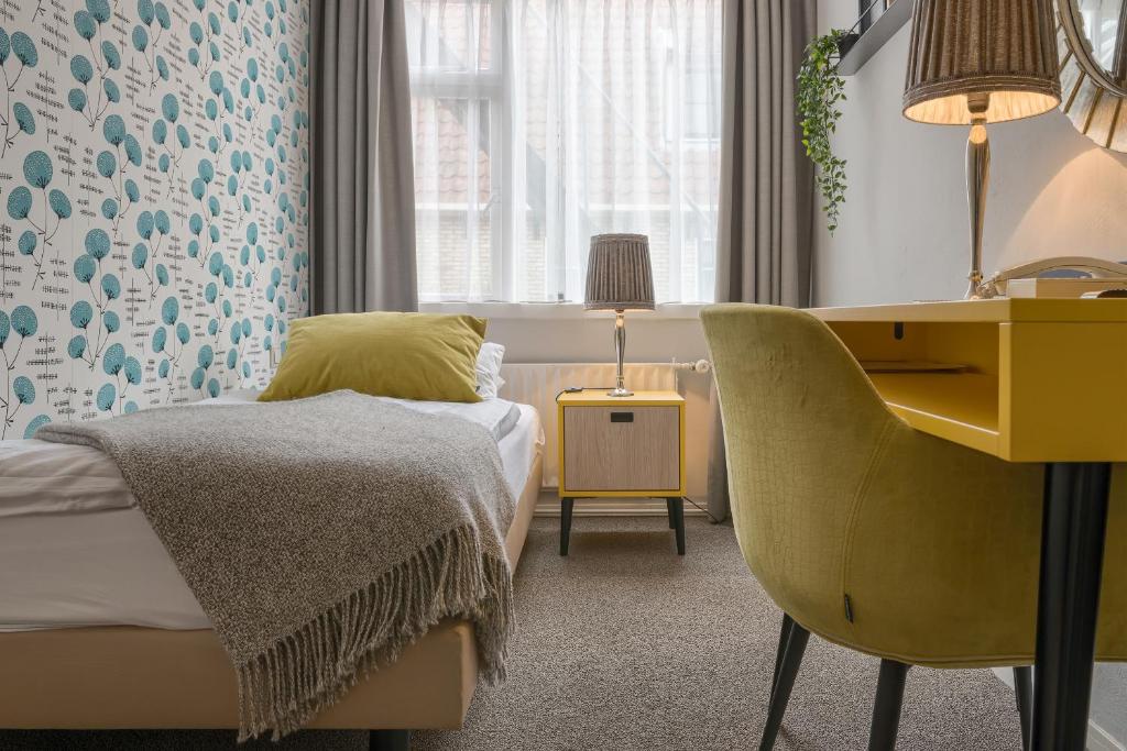 Postel nebo postele na pokoji v ubytování Hotel Op Diek