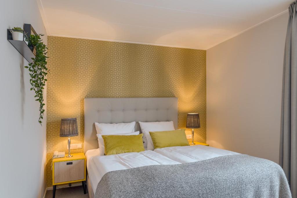 Postel nebo postele na pokoji v ubytování Hotel Op Diek