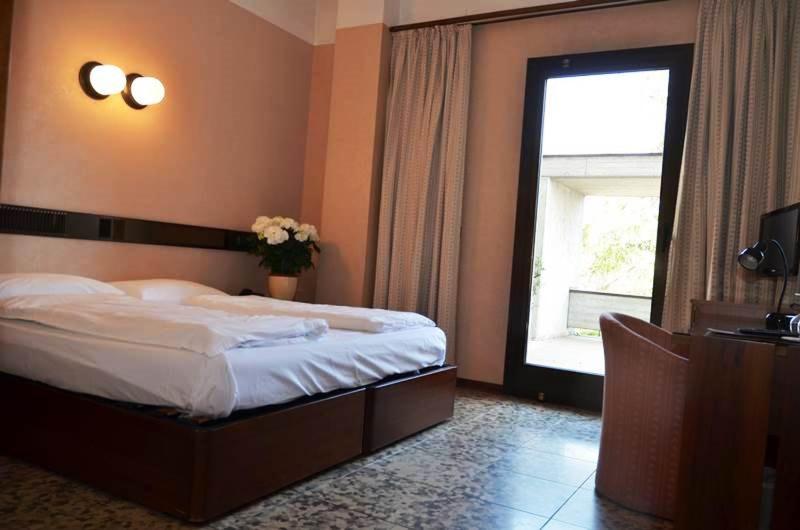 Postel nebo postele na pokoji v ubytování Parc Hotel Casa Mia