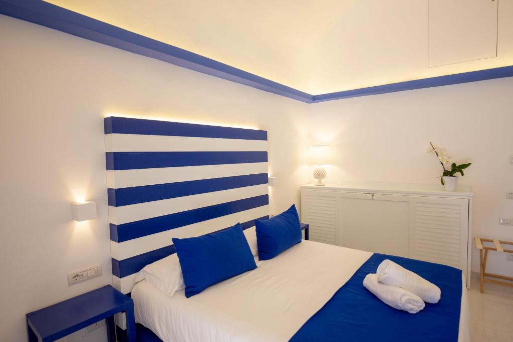 Postel nebo postele na pokoji v ubytování Hotel Il Faro