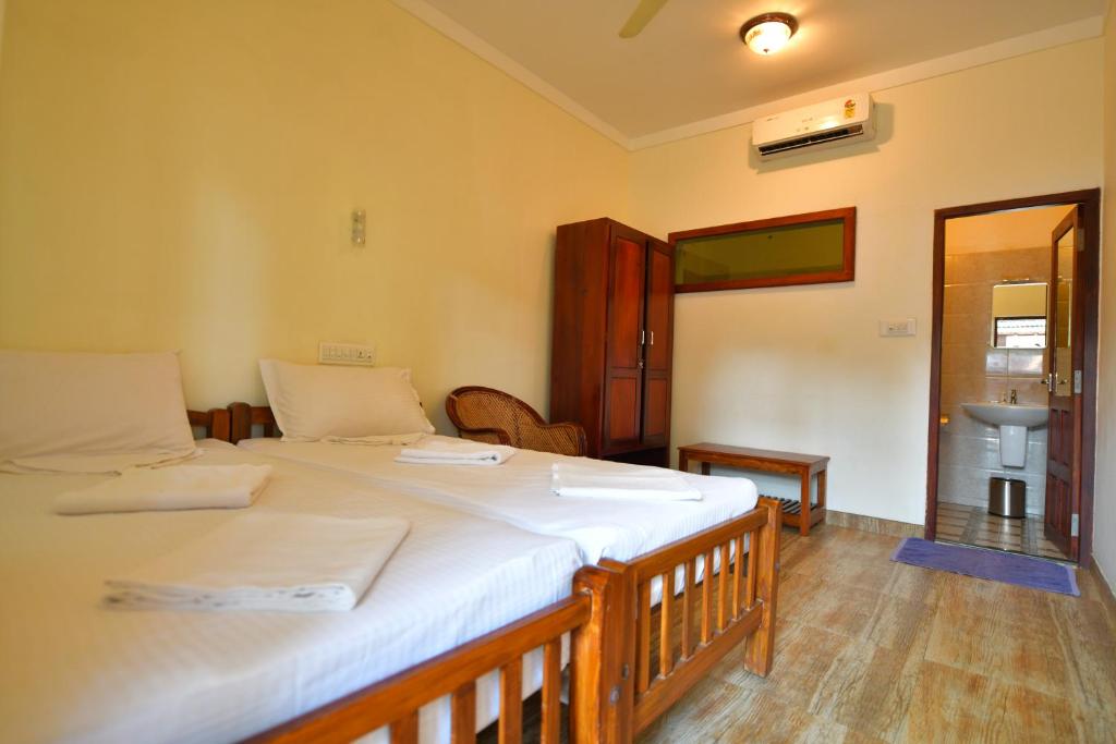 Postel nebo postele na pokoji v ubytování Cherai Onetree Retreat