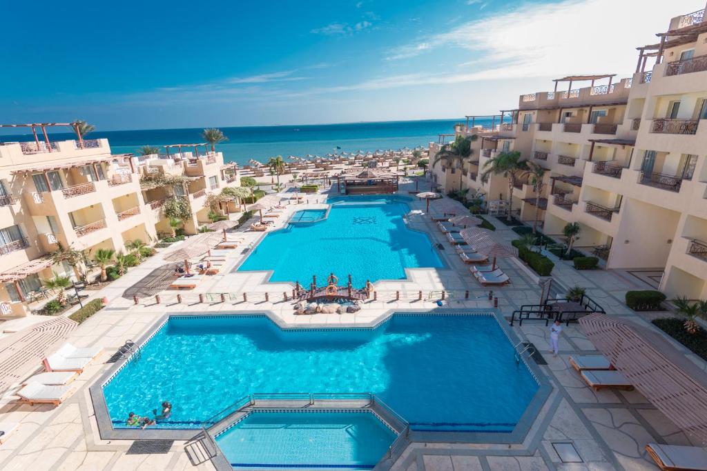 an aerial view of a resort with a swimming pool at Imperial Shams Abu Soma in Hurghada