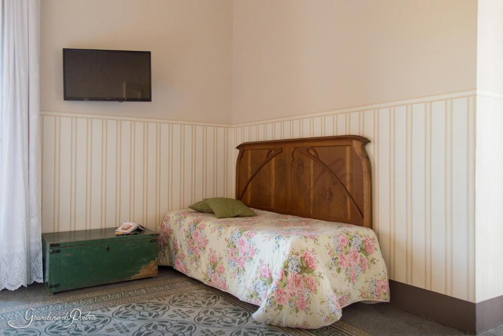 Postel nebo postele na pokoji v ubytování B&B Giardino Di Pietra