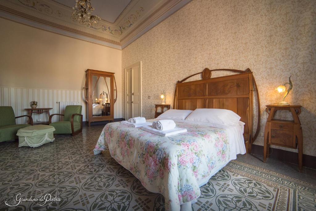 Postel nebo postele na pokoji v ubytování B&B Giardino Di Pietra