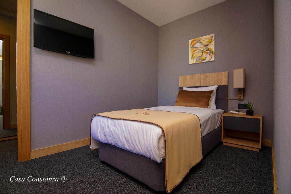 Postel nebo postele na pokoji v ubytování Casa Constanza Hotel Garni