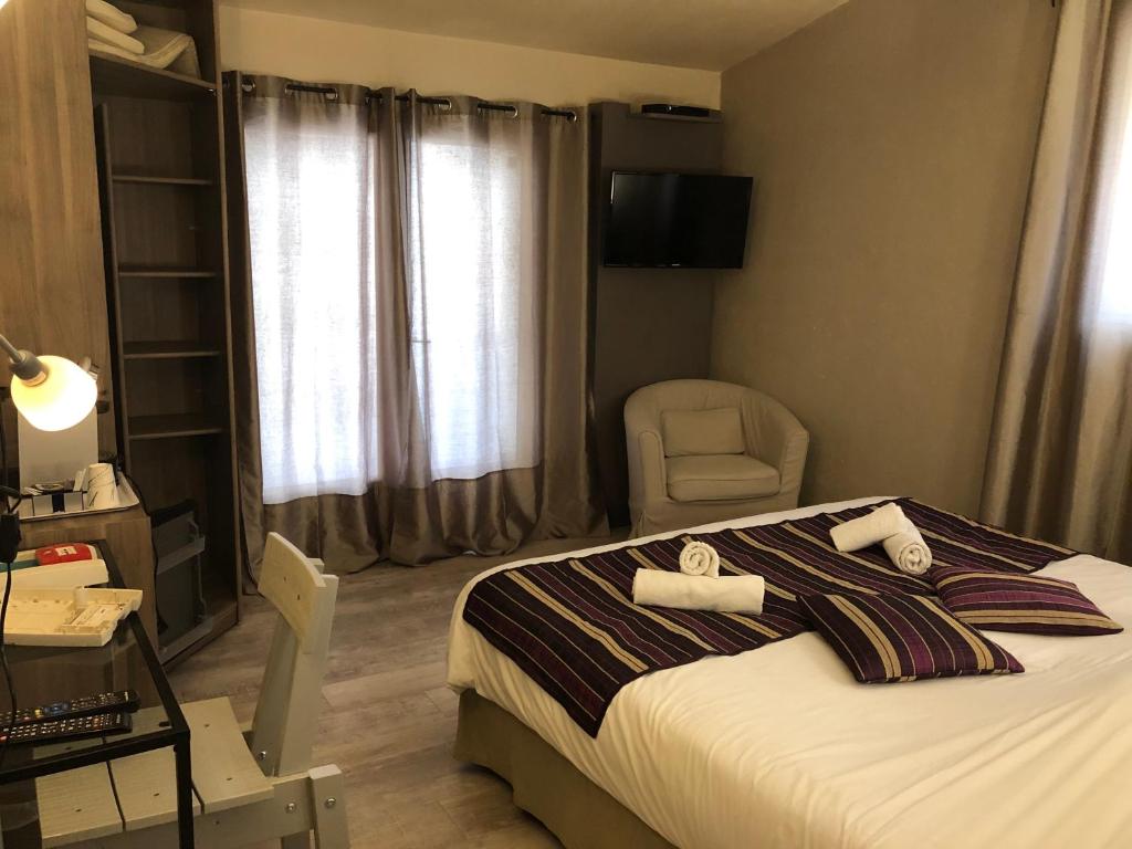 Postel nebo postele na pokoji v ubytování Le Mas Saint Donat