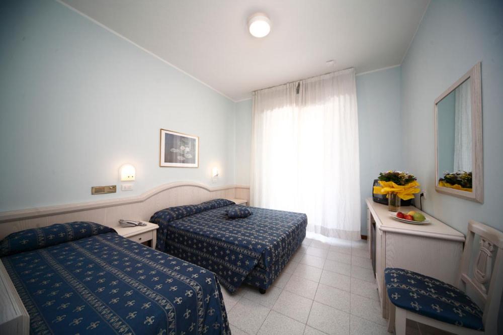 Postel nebo postele na pokoji v ubytování Hotel Splendid Mare