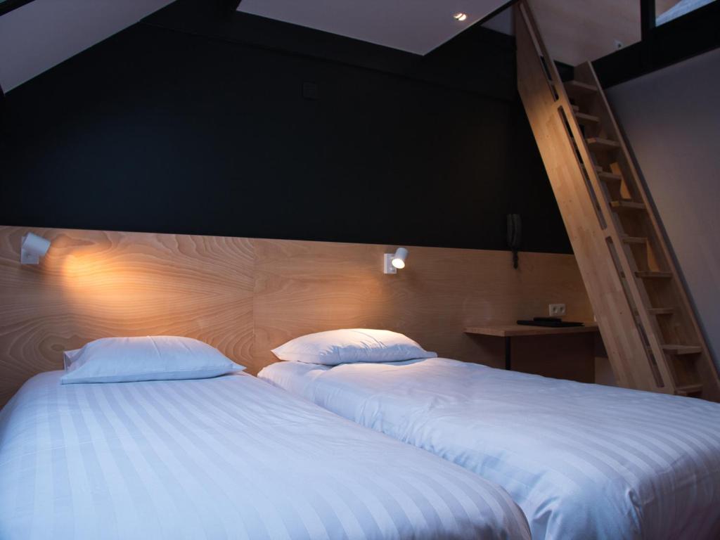 Postel nebo postele na pokoji v ubytování Hotel Aquatel