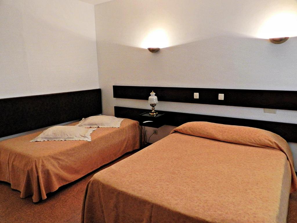 Postel nebo postele na pokoji v ubytování Hotel Val Flores