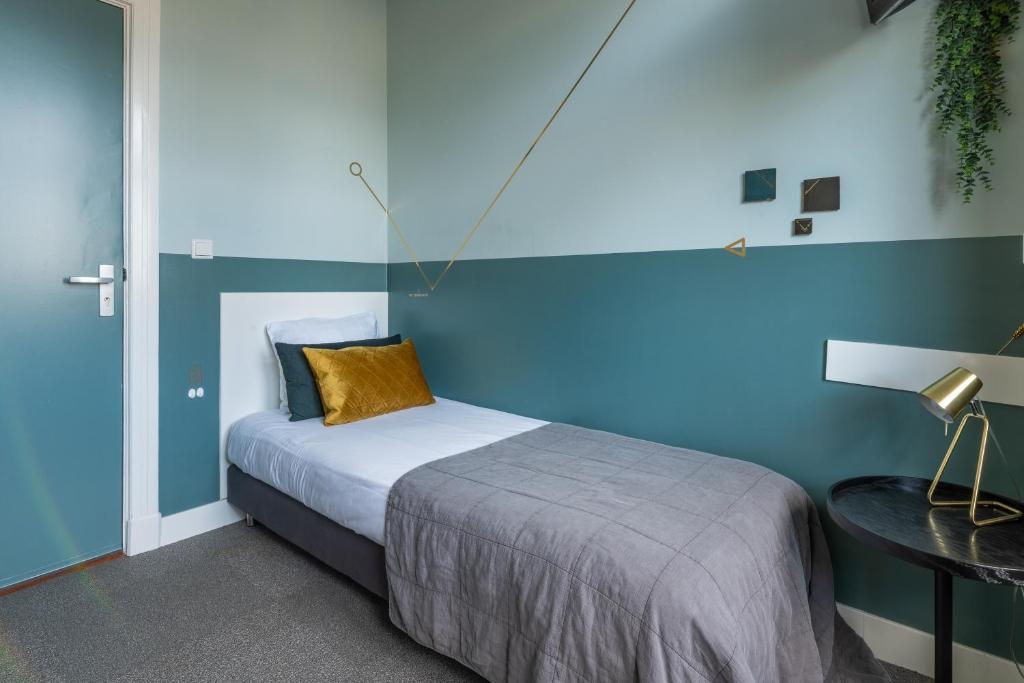 Postel nebo postele na pokoji v ubytování Boutique Hotel Het Scheepshuys
