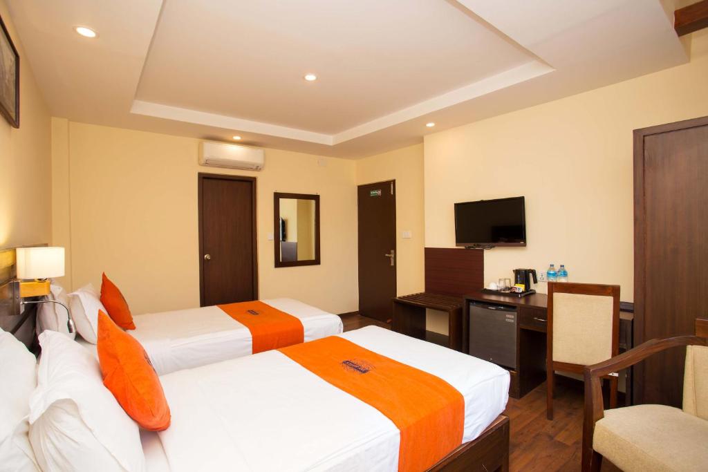 TV a/nebo společenská místnost v ubytování Hotel Jay Suites