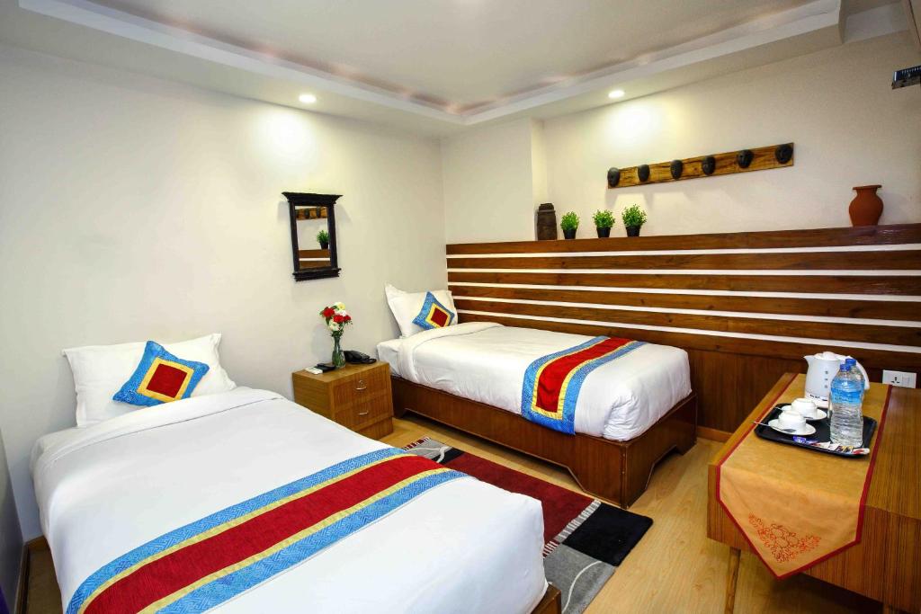 Postel nebo postele na pokoji v ubytování Asian Boutique Hotel