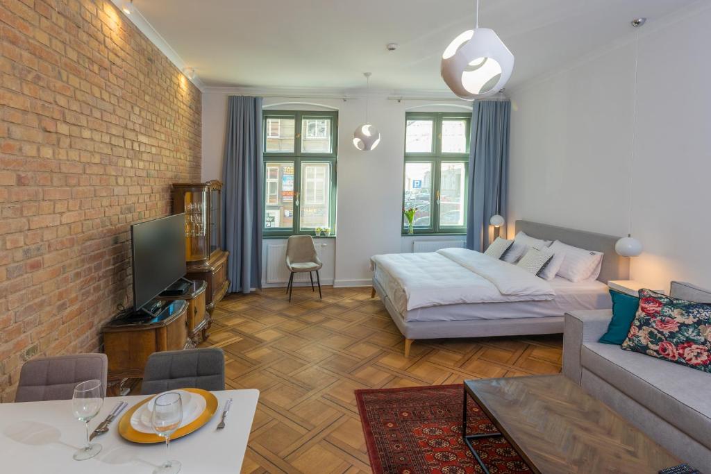 Posteľ alebo postele v izbe v ubytovaní PROVENIR HOME STRZELECKA 25