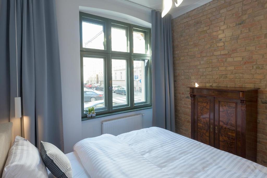 Posteľ alebo postele v izbe v ubytovaní PROVENIR HOME STRZELECKA 25