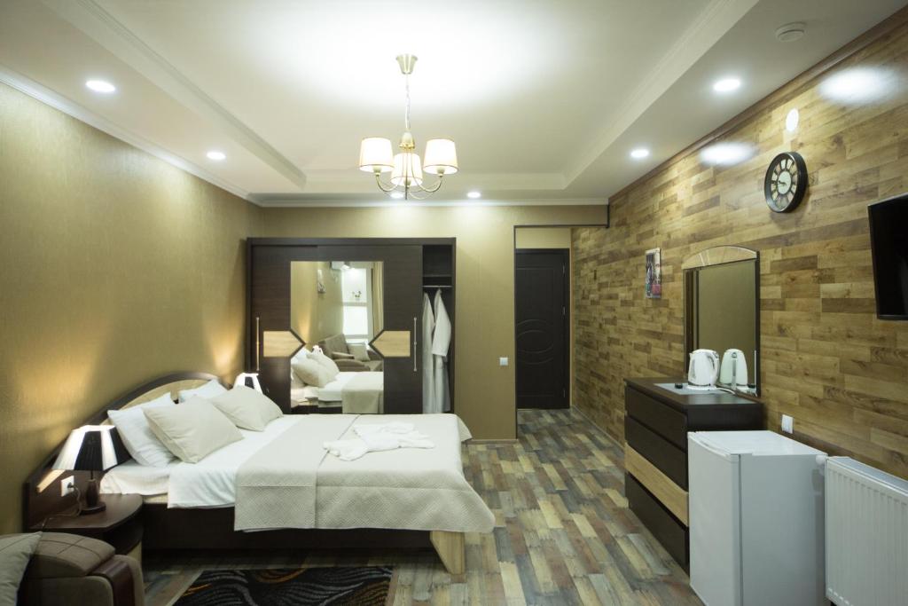 Postel nebo postele na pokoji v ubytování Hotel Dimasi