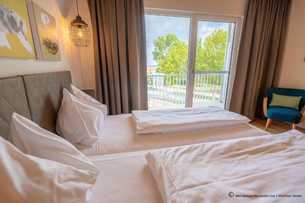 Posteľ alebo postele v izbe v ubytovaní Hotel Katamaran