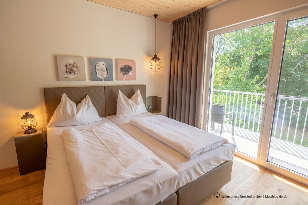 Posteľ alebo postele v izbe v ubytovaní Hotel Katamaran