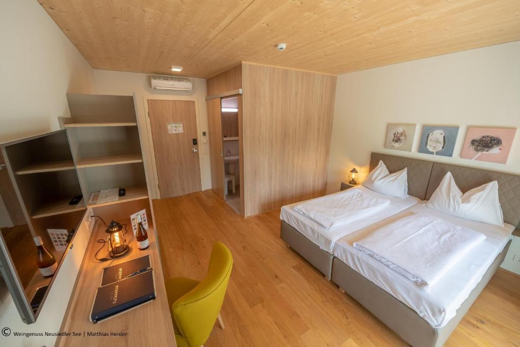 Posteľ alebo postele v izbe v ubytovaní Hotel Katamaran