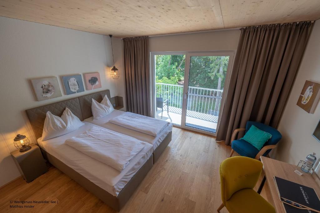 Posteľ alebo postele v izbe v ubytovaní Hotel Katamaran