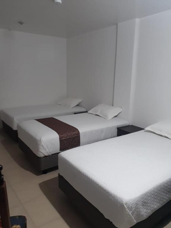 Postel nebo postele na pokoji v ubytování Hotel Kampak Wasi