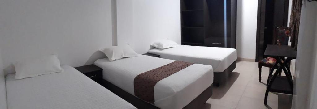 Postel nebo postele na pokoji v ubytování Hotel Kampak Wasi