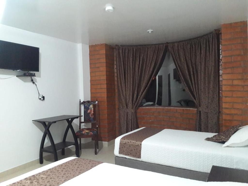 Postel nebo postele na pokoji v ubytování Hotel Kampak Wasi