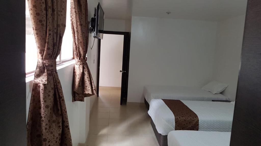 Postel nebo postele na pokoji v ubytování Hotel Kampak Wasi
