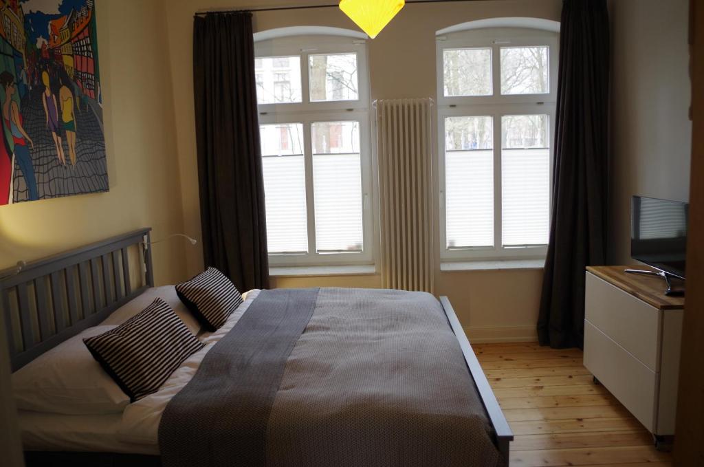 Postel nebo postele na pokoji v ubytování Villa Friedenstraße 11