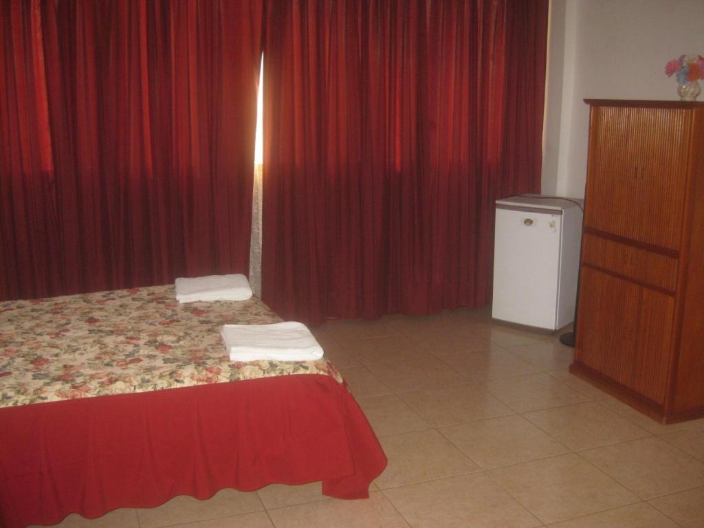 Postel nebo postele na pokoji v ubytování Hostal Camiluz