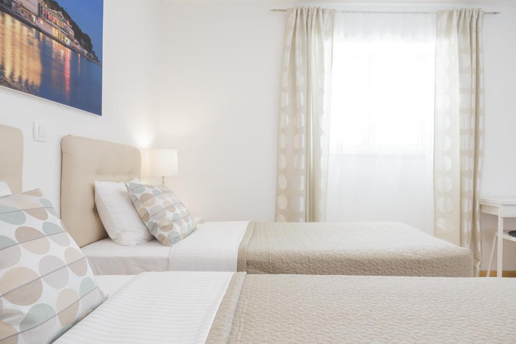 Posteľ alebo postele v izbe v ubytovaní Holiday Home Aspalathos - with free parking, near the beach, a few minutes' walking distance to the UNESCO Palace
