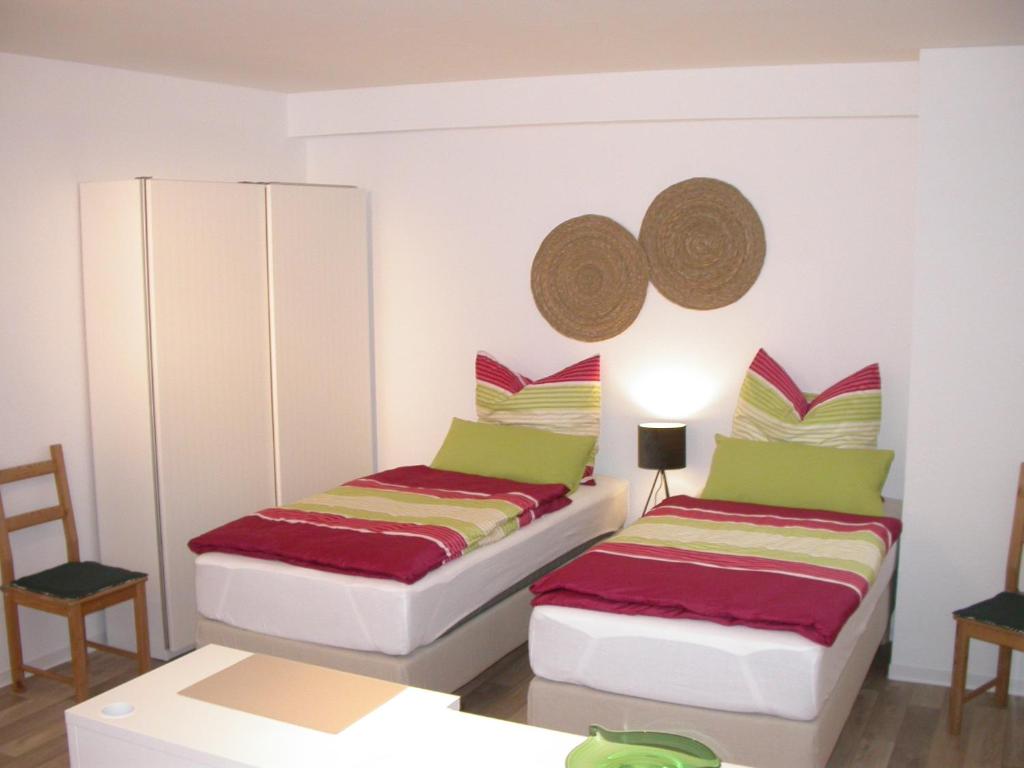 Кровать или кровати в номере Haus Bergstrasse