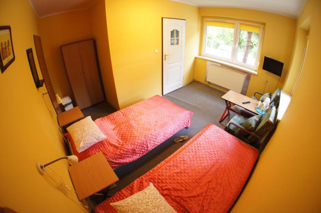 Posteľ alebo postele v izbe v ubytovaní Nest Nocleg Poznań