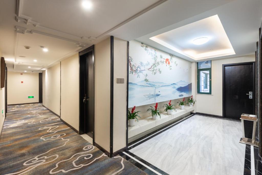 TV a/nebo společenská místnost v ubytování Yiwu Luckbear Hotel