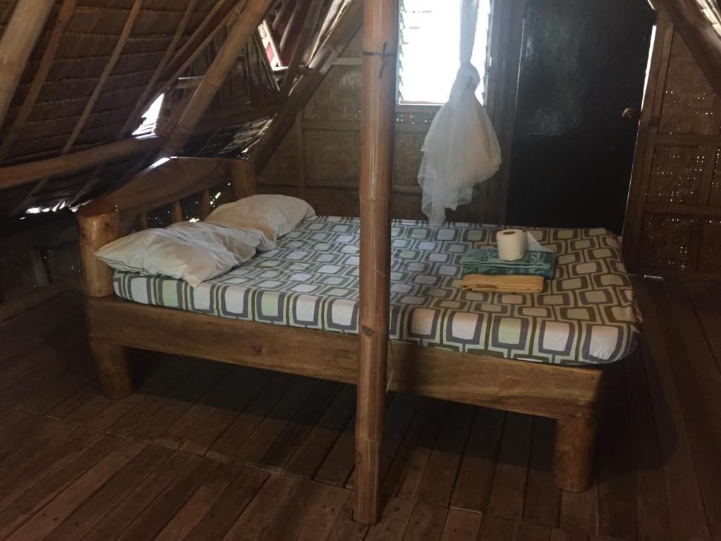 A bed or beds in a room at Buenaventura Beachresort