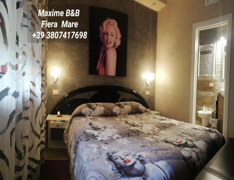 A bed or beds in a room at Max B&B Fiera