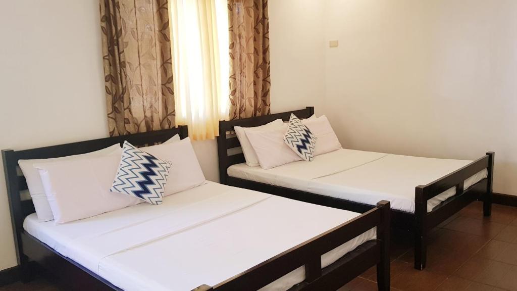 Postel nebo postele na pokoji v ubytování Luxor Resort