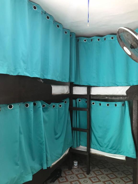 Postel nebo postele na pokoji v ubytování Malapascua Budget Inn MBI DIVE CENTER