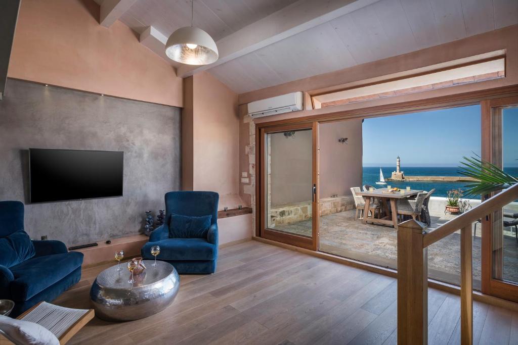 TV a/nebo společenská místnost v ubytování Residenza Vranas Boutique Hotel