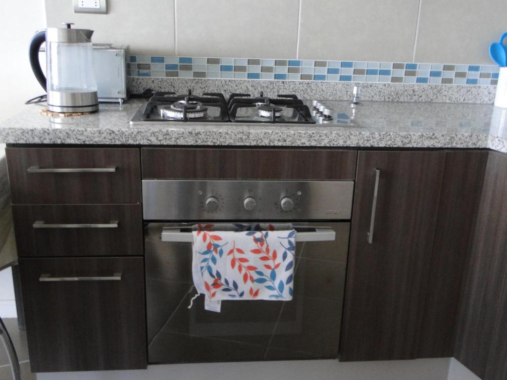 Kuchyň nebo kuchyňský kout v ubytování Condominio Arena Maris