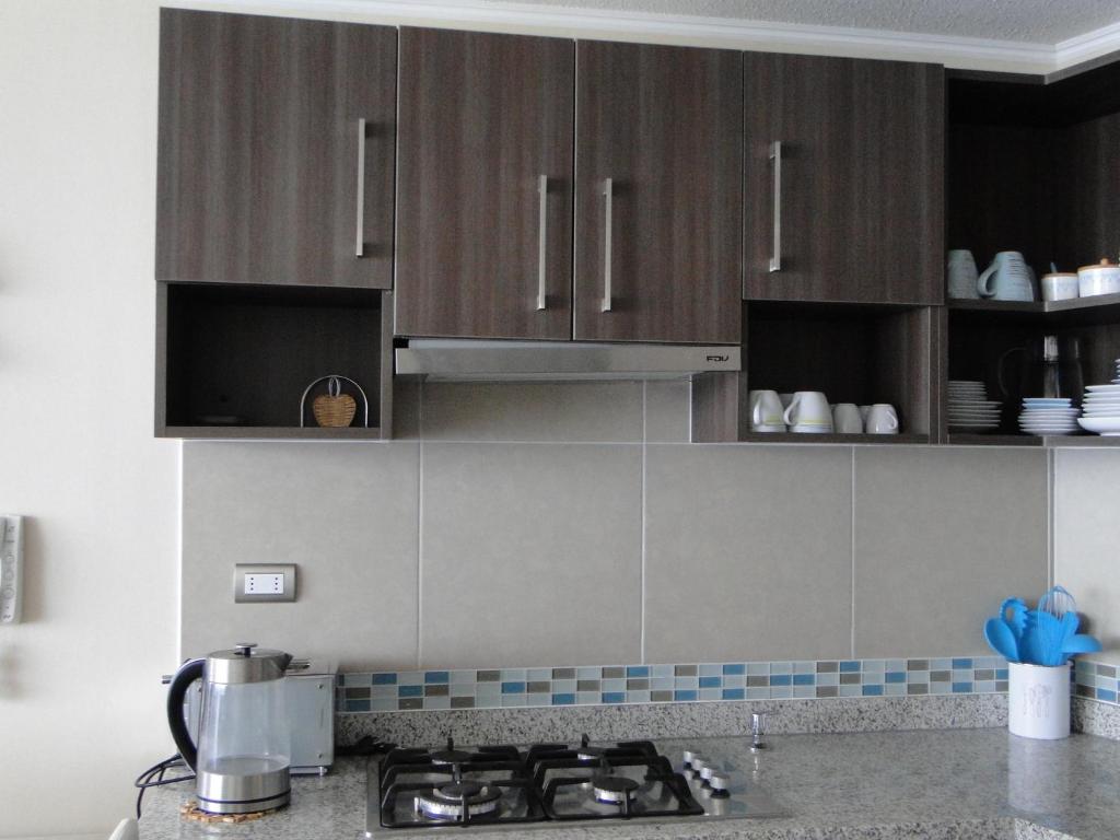 Kuchyň nebo kuchyňský kout v ubytování Condominio Arena Maris