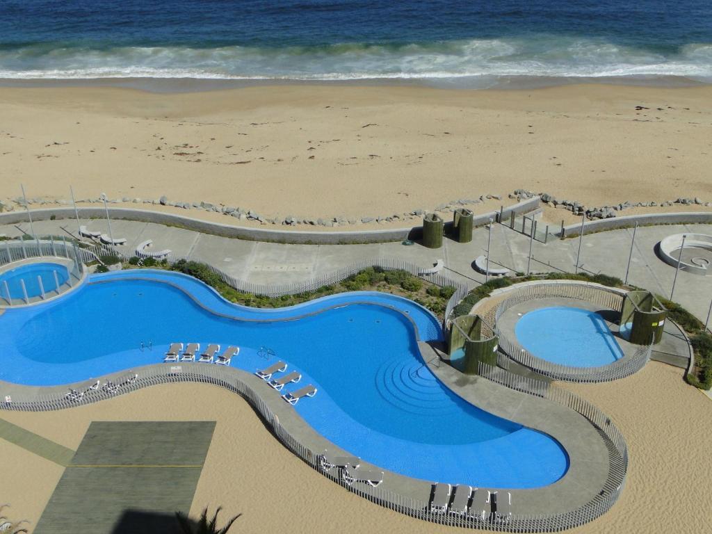 Bazén v ubytování Condominio Arena Maris nebo v jeho okolí
